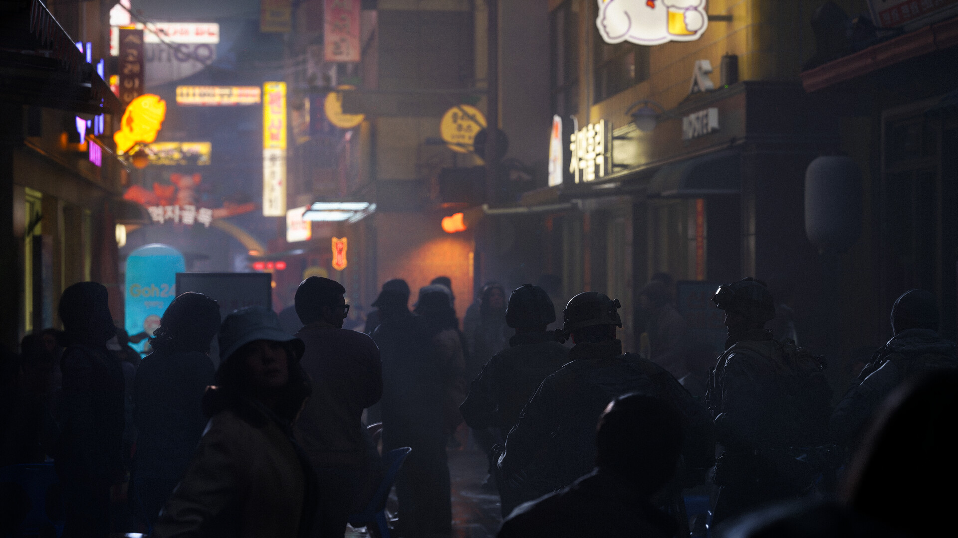 Crowded Korean street market at night in fog